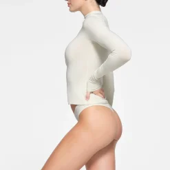 COTTON JERSEY LONG SLEEVE TURTLENECK |-Skims Online